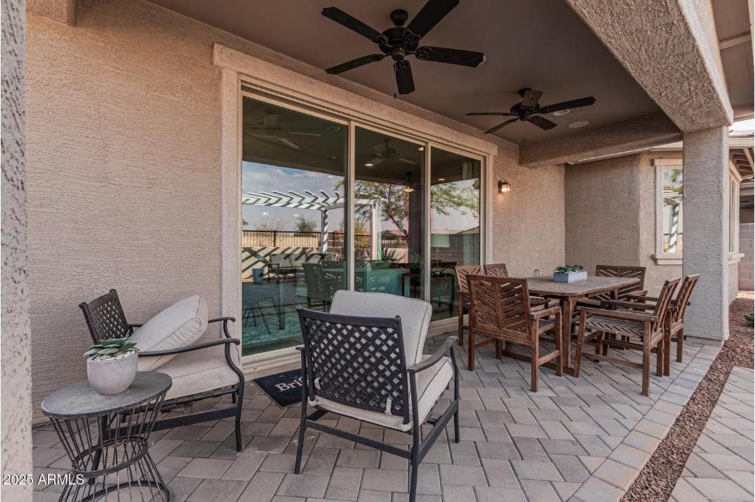 17386 West Bloomfield Road Surprise, AZ 85388 - Photo 29 of 31 a outdoor space with lots of furniture and glass door