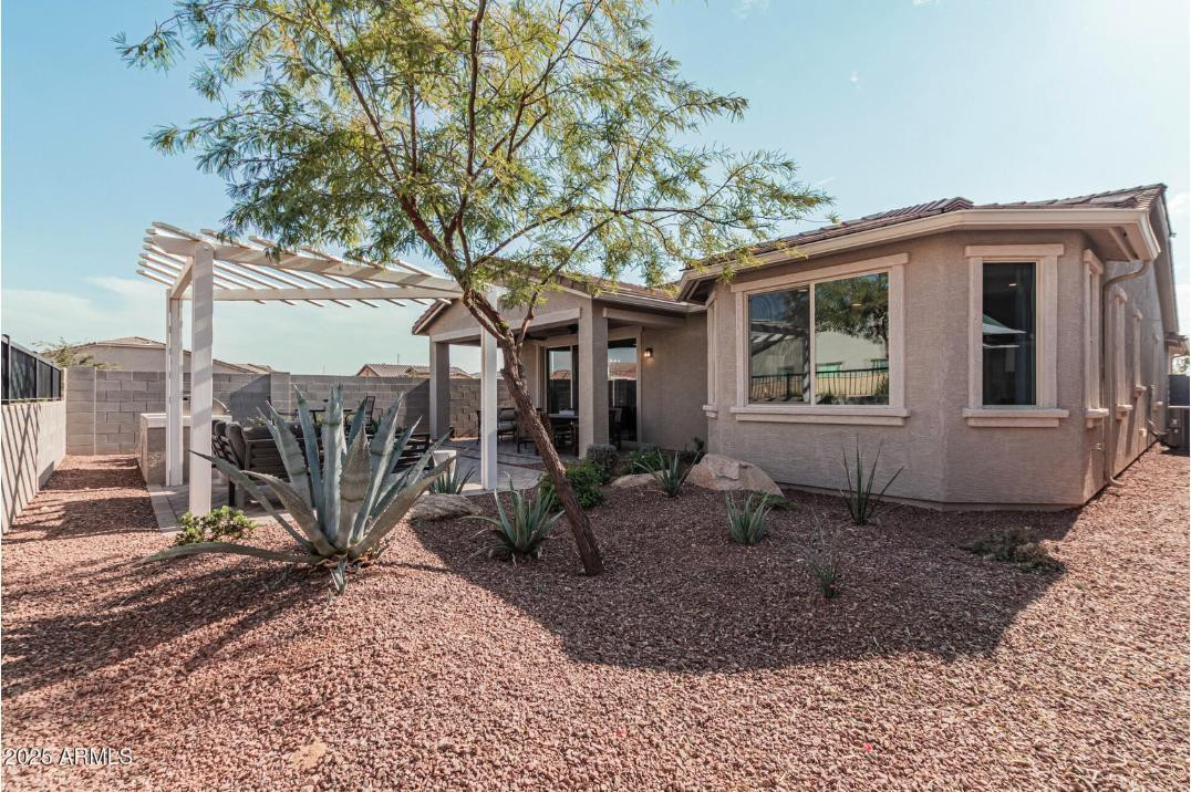 17386 West Bloomfield Road Surprise, AZ 85388 - Photo 31 of 31 a house view with a backyard space