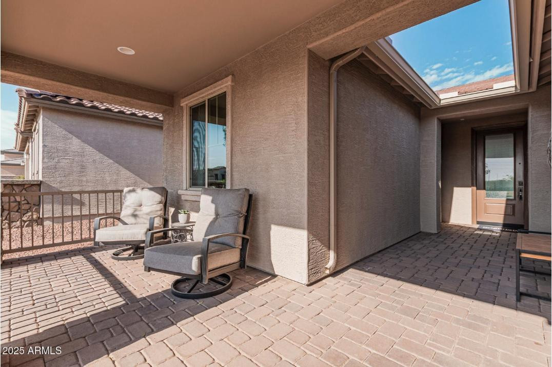 17386 West Bloomfield Road Surprise, AZ 85388 - Photo 4 of 31 a building outdoor space with patio furniture