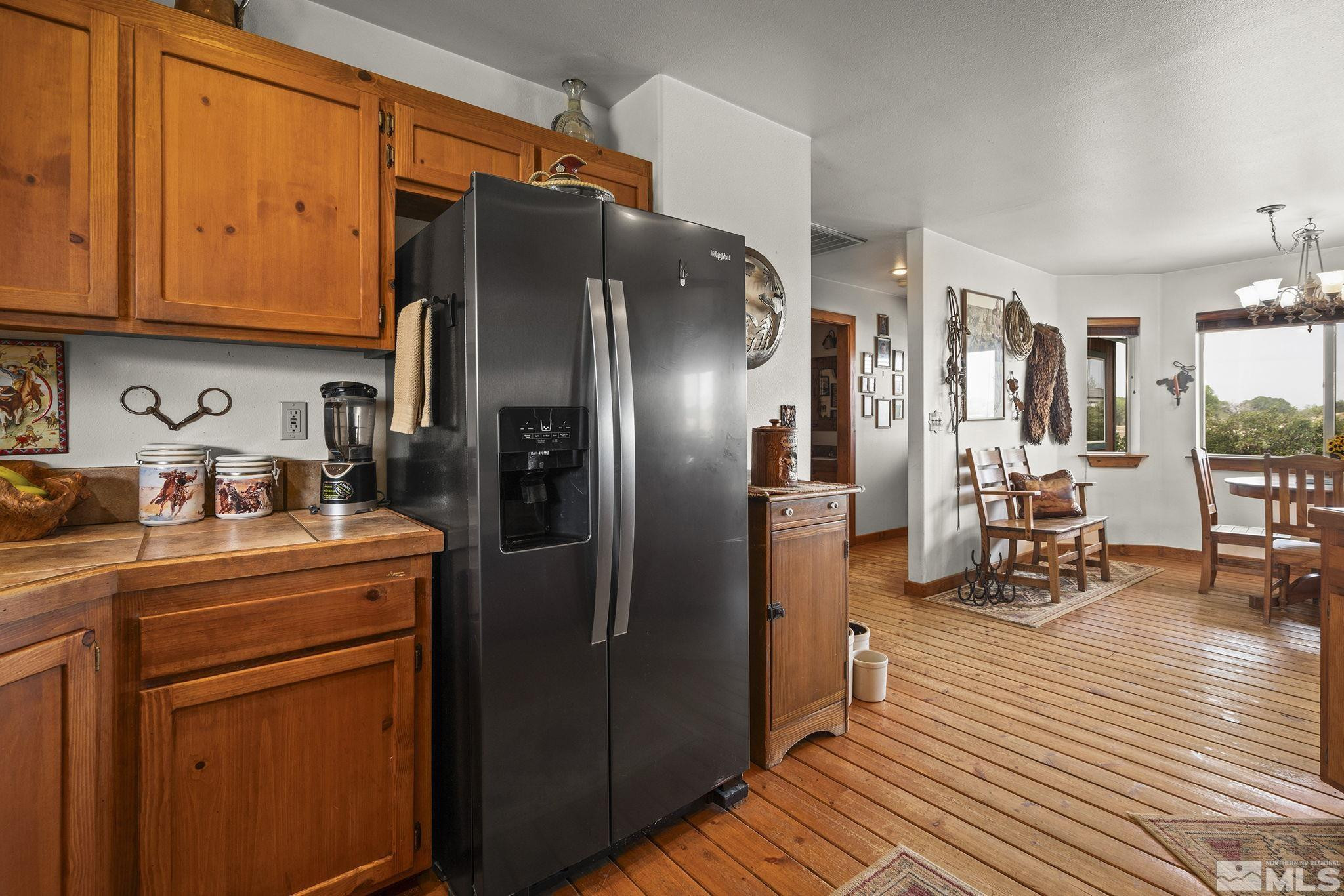 6811 Reno Highway Fallon, NV 89406 - Photo 11 of 33 a kitchen with stainless steel appliances granite countertop a refrigerator and stove