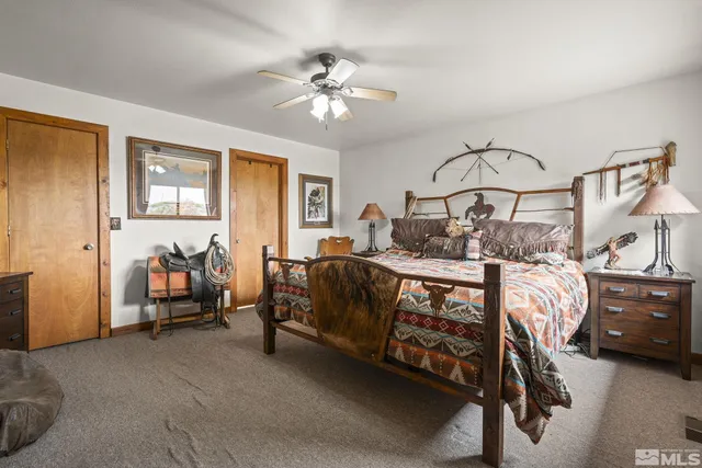 a bedroom with bed and window