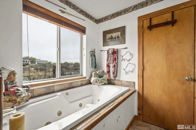 a bath tub sitting next to a window