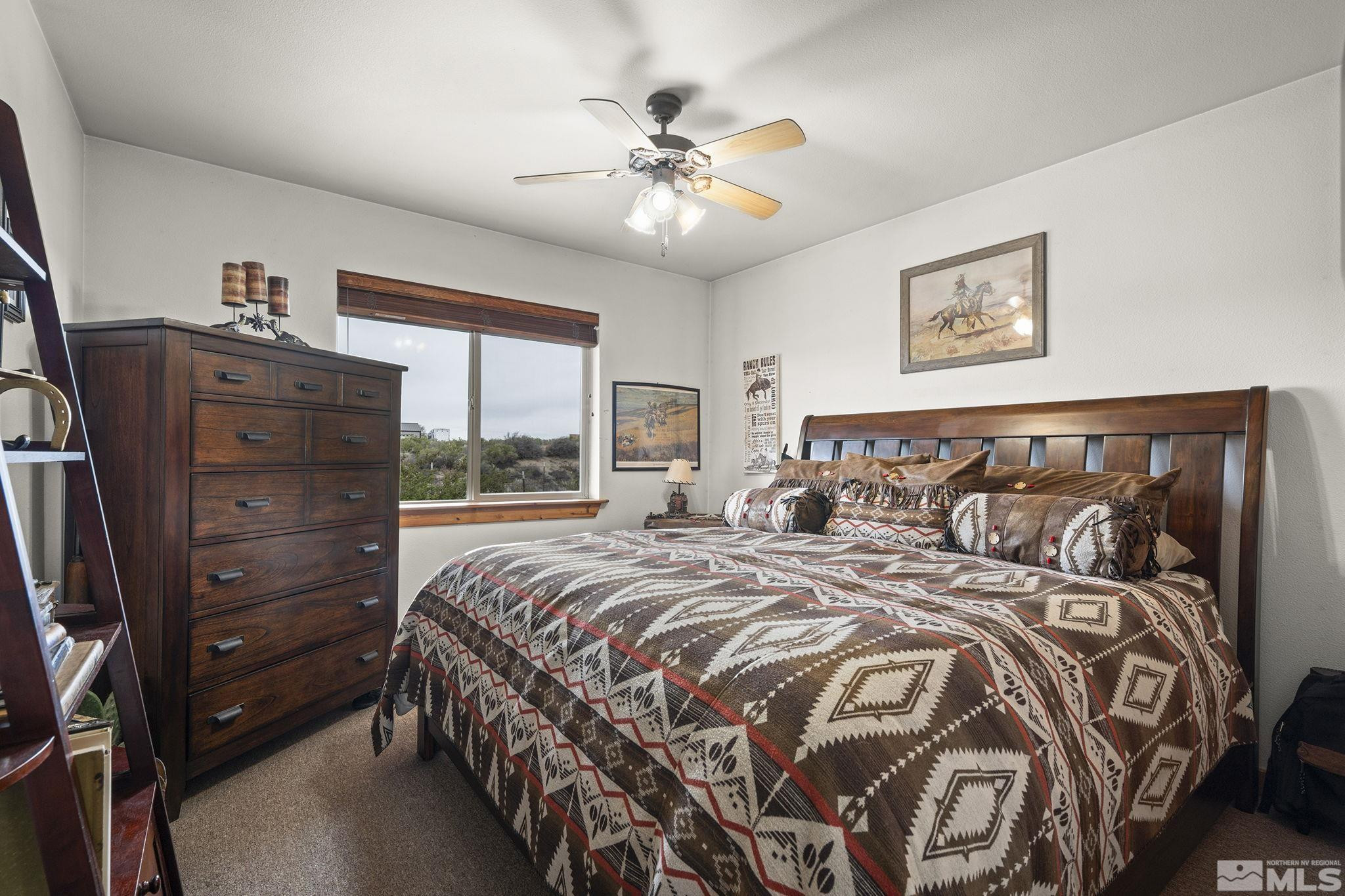 6811 Reno Highway Fallon, NV 89406 - Photo 15 of 33 a bedroom with a large bed and a window