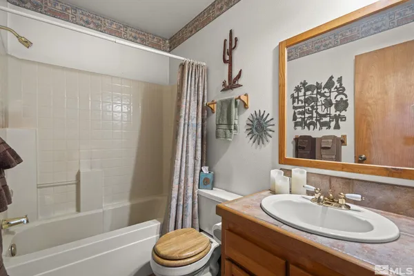 a bathroom with a sink a toilet and a bathtub