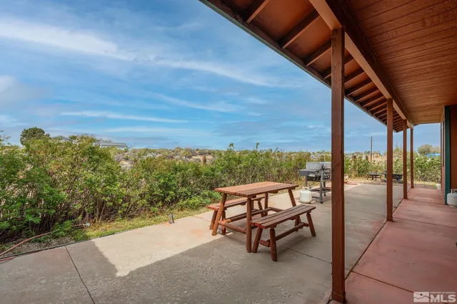 a view of a two chairs in the roof deck