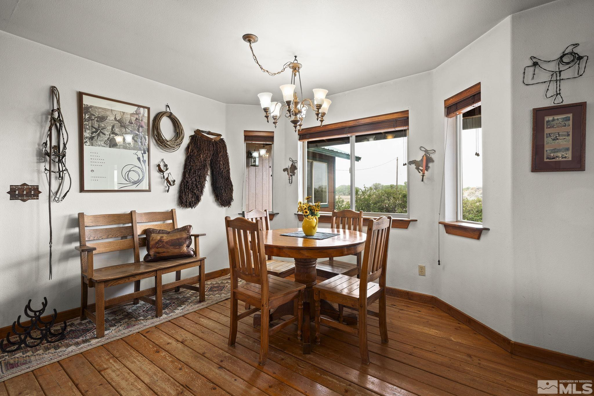 6811 Reno Highway Fallon, NV 89406 - Photo 7 of 33 a view of a dining room with furniture window and wooden floor