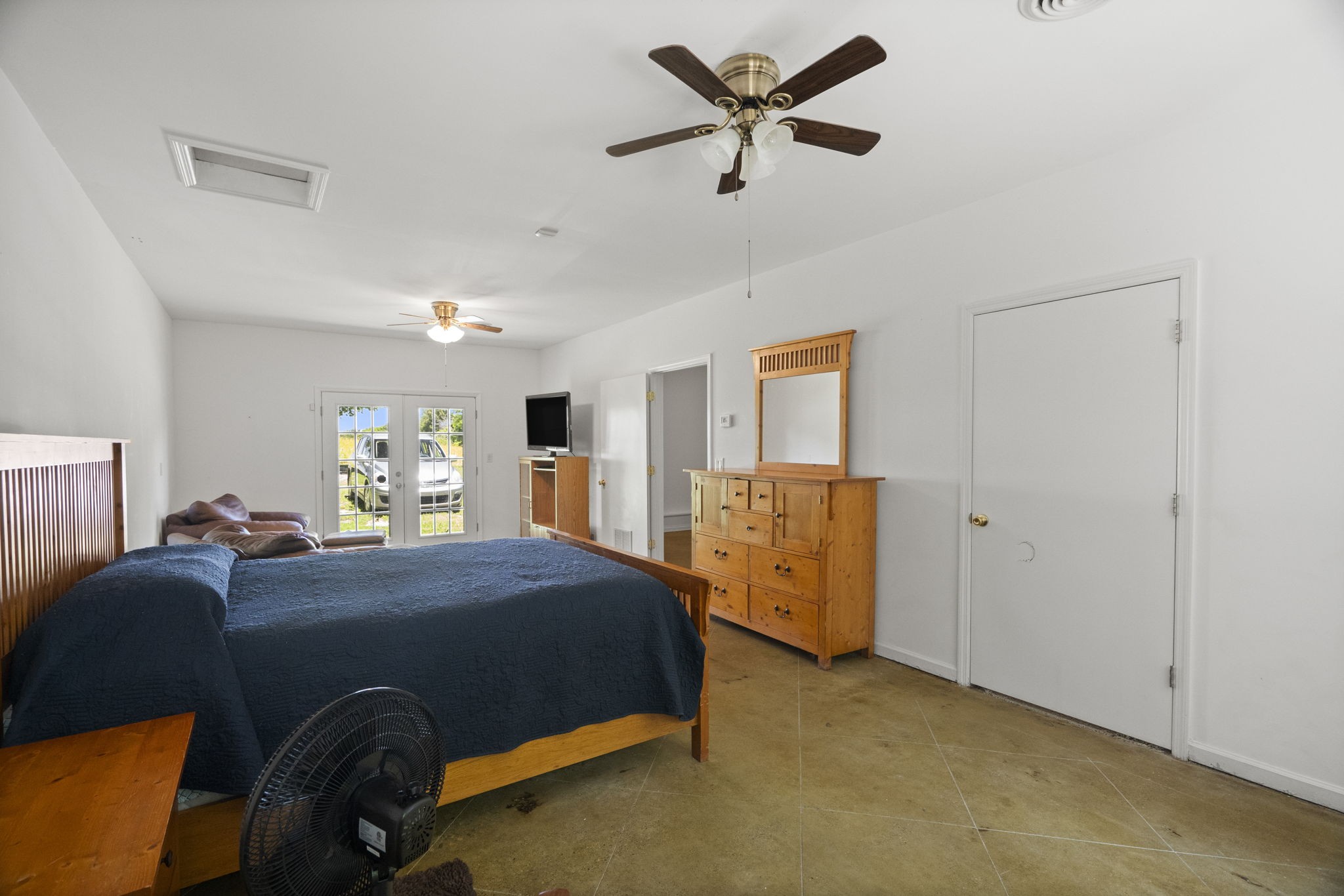 4266 Dot Road Springfield, TN 37172 - Photo 19 of 70 a bedroom with a bed and a chandelier