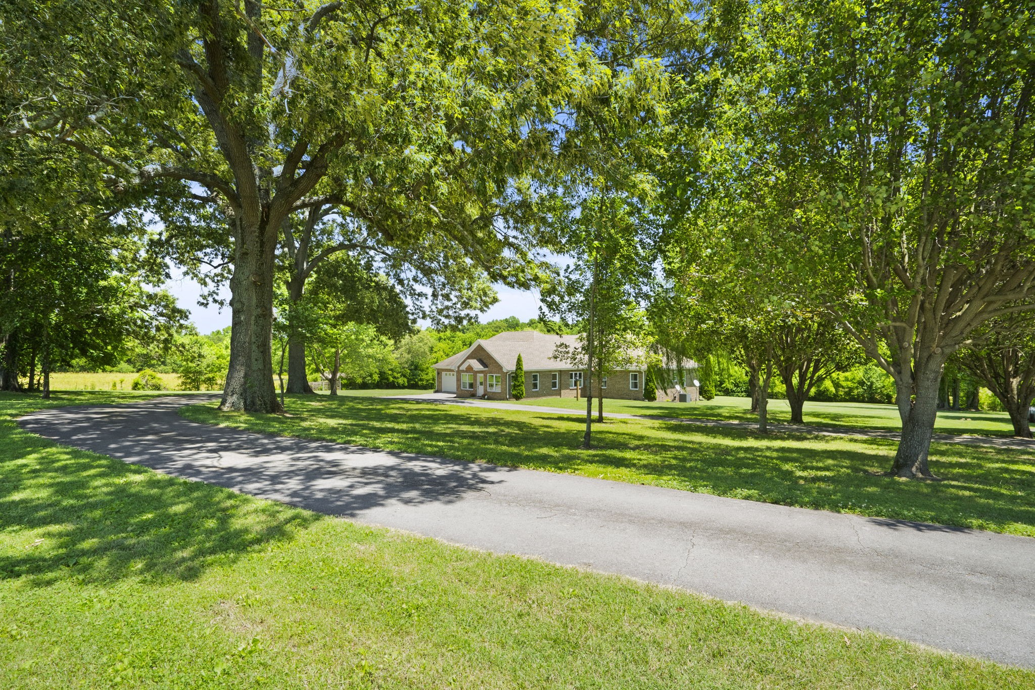 4266 Dot Road Springfield, TN 37172 - Photo 32 of 70 a view of a house with a big yard and large trees