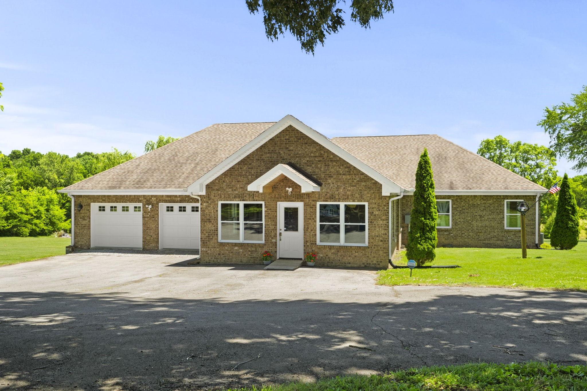4266 Dot Road Springfield, TN 37172 - Photo 35 of 70 a front view of a house with a garden and trees