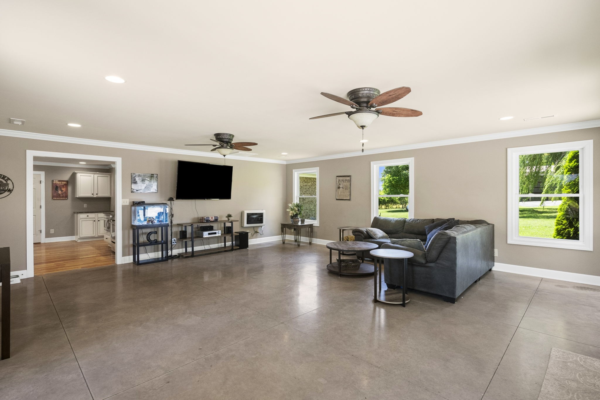 4266 Dot Road Springfield, TN 37172 - Photo 37 of 70 a living room with furniture and a flat screen tv with kitchen view