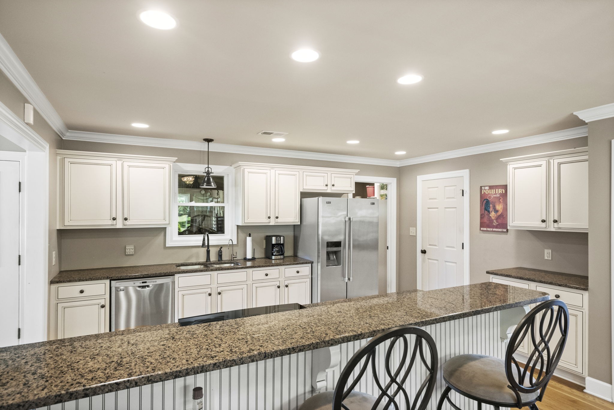 4266 Dot Road Springfield, TN 37172 - Photo 44 of 70 a kitchen with stainless steel appliances granite countertop a stove a sink a refrigerator with white cabinets and couches