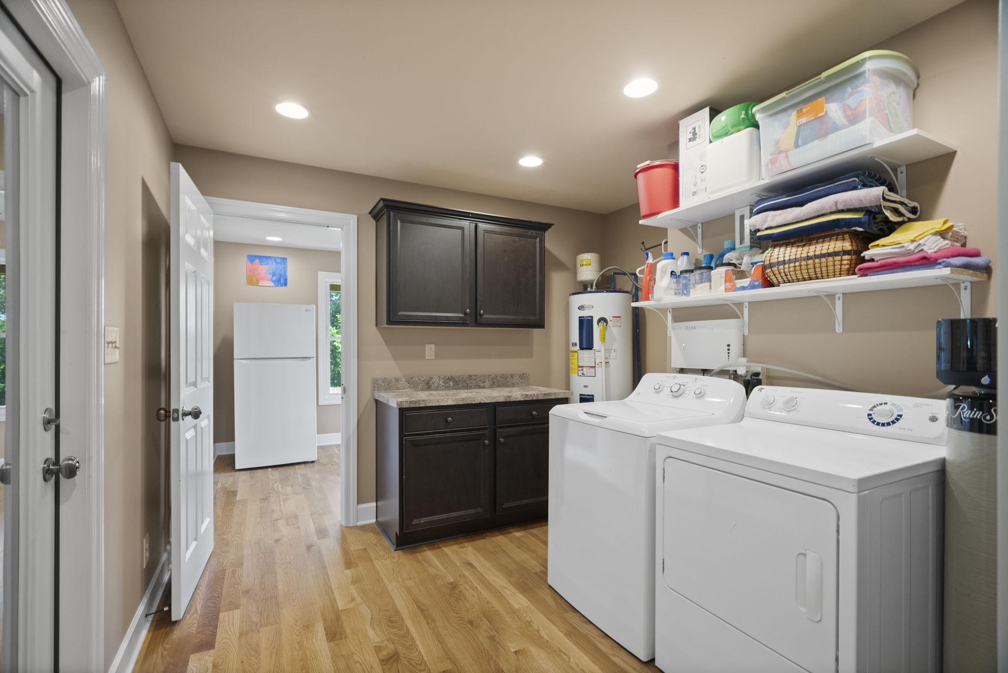 4266 Dot Road Springfield, TN 37172 - Photo 59 of 70 a kitchen that has a lot of cabinets in it and wooden floor