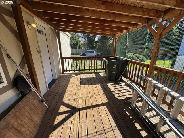 a view of balcony with wooden floor