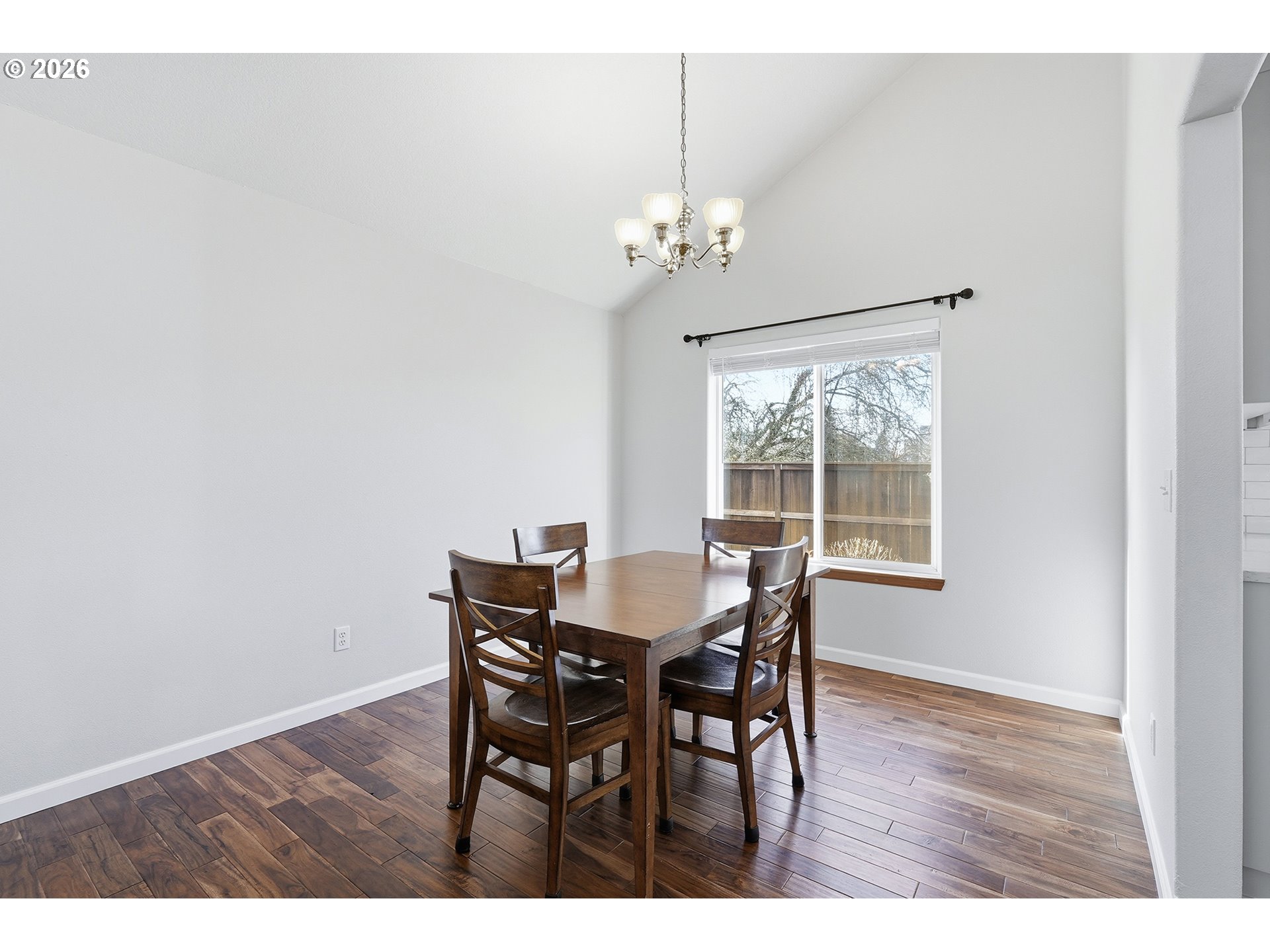 1579 Southwest 213th Avenue Beaverton, OR 97003 - Photo 11 of 48 a view of a dining room with furniture a chandelier and wooden floor