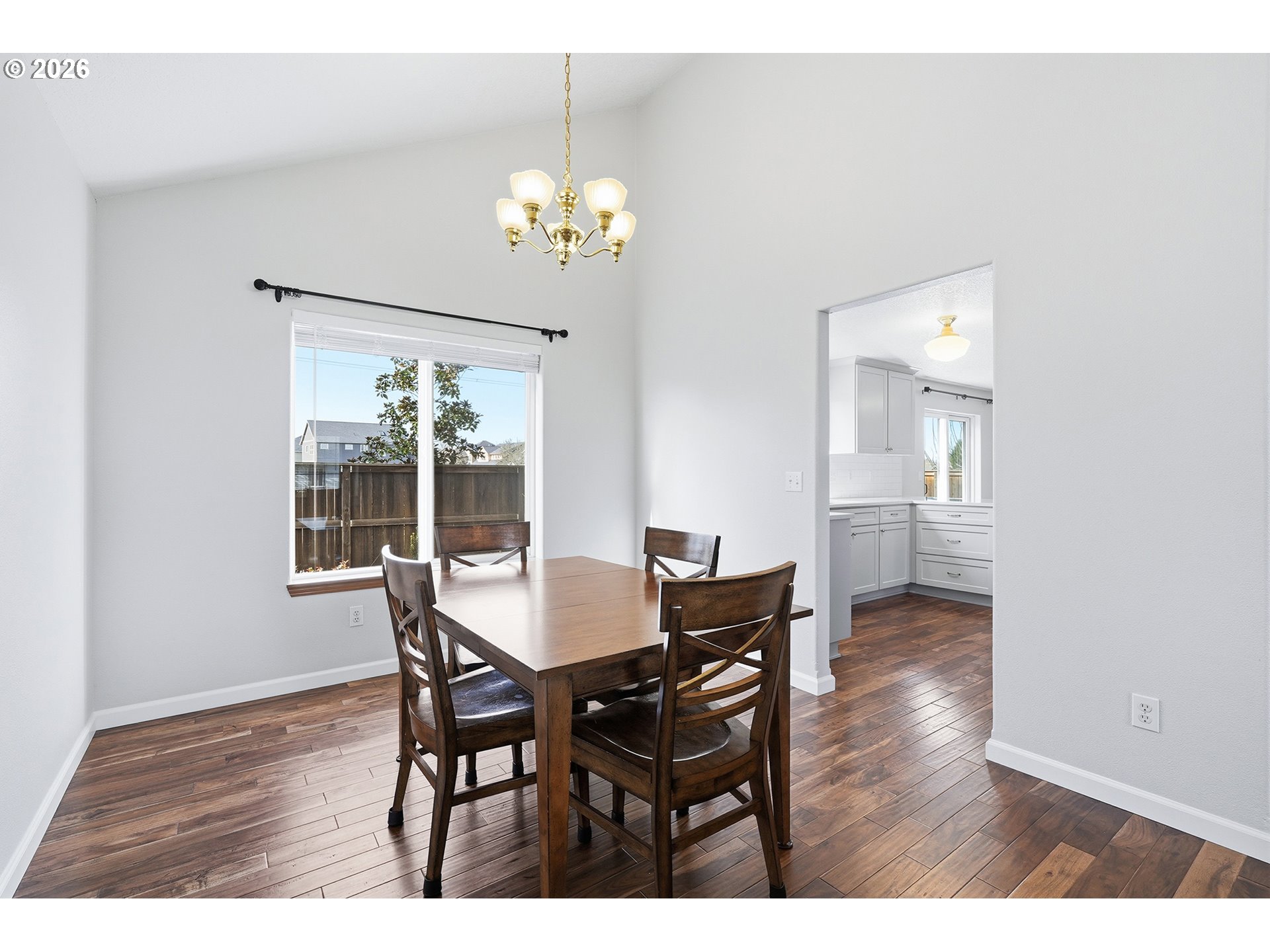 1579 Southwest 213th Avenue Beaverton, OR 97003 - Photo 13 of 48 a view of a dining room with furniture and wooden floor