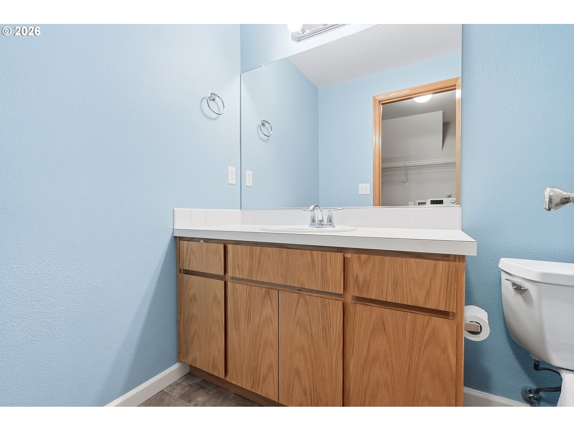 1579 Southwest 213th Avenue Beaverton, OR 97003 - Photo 23 of 48 a bathroom with a sink a toilet and mirror