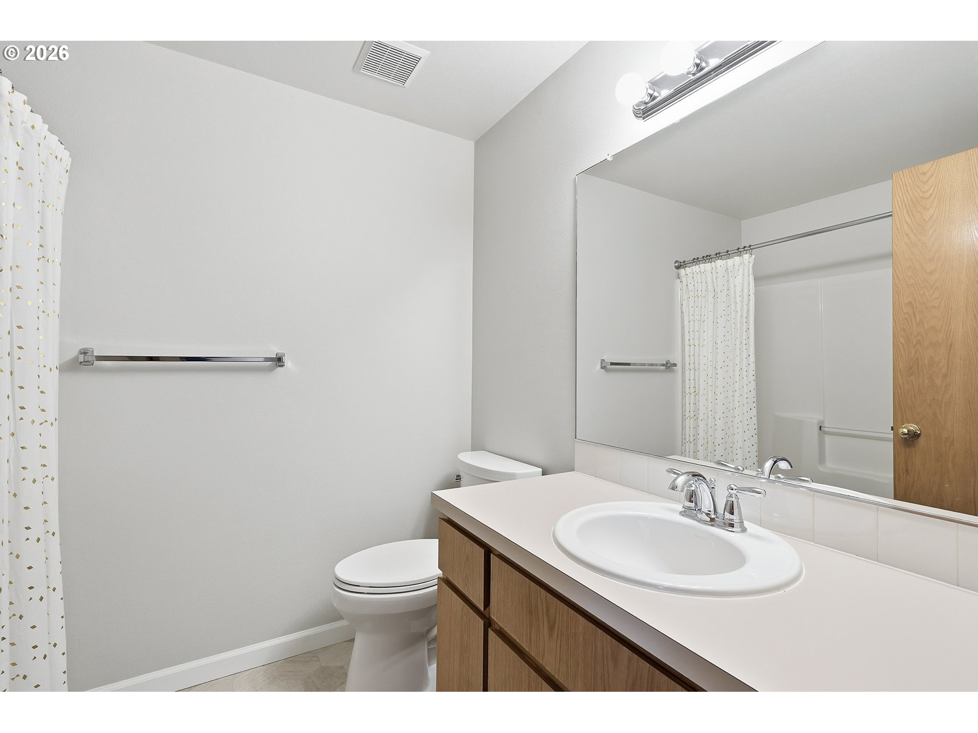 1579 Southwest 213th Avenue Beaverton, OR 97003 - Photo 25 of 48 a bathroom with a toilet a sink a mirror and vanity