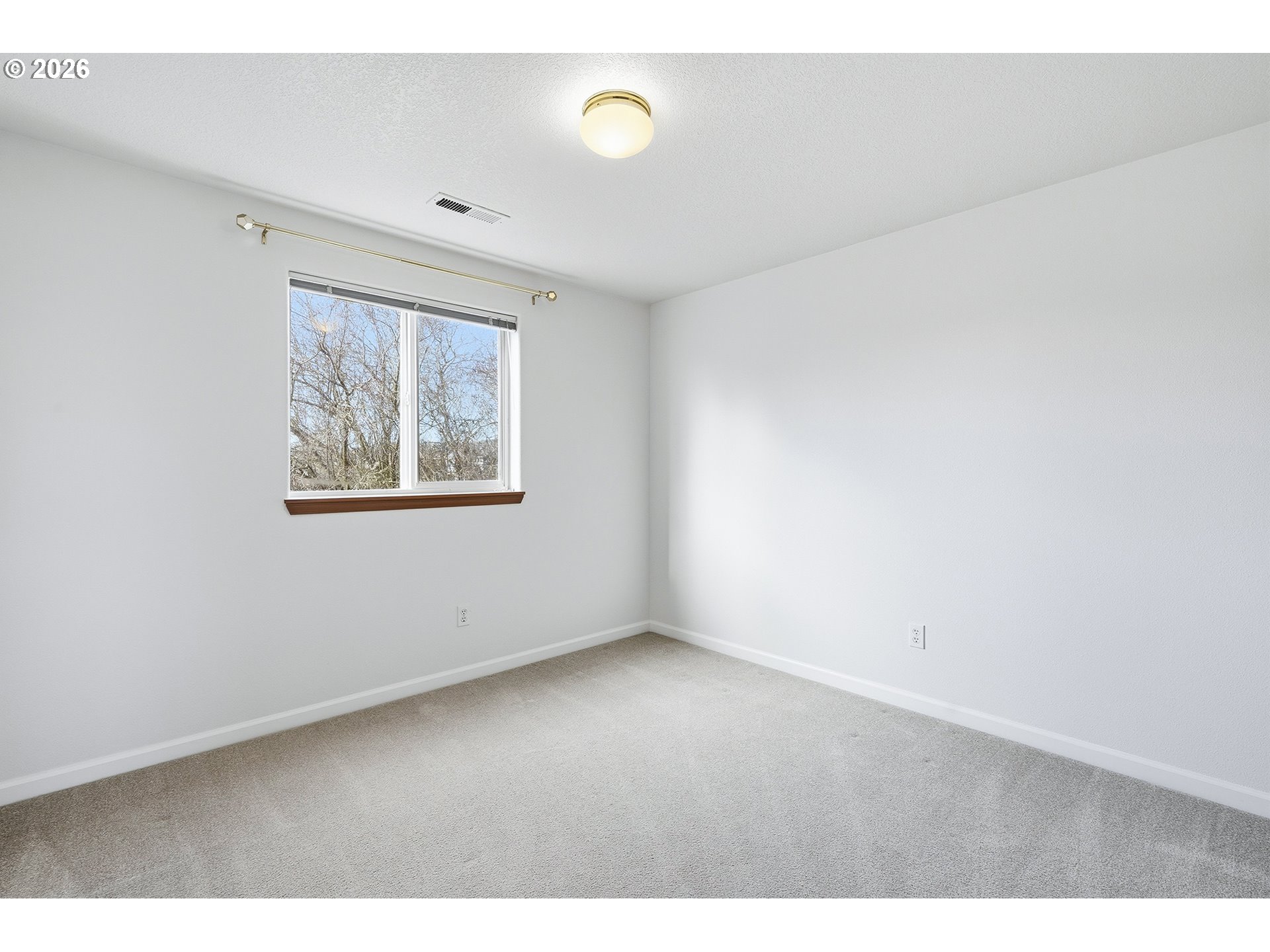 1579 Southwest 213th Avenue Beaverton, OR 97003 - Photo 26 of 48 a view of an empty room with a window