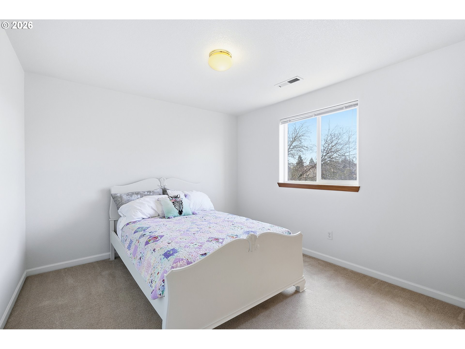 1579 Southwest 213th Avenue Beaverton, OR 97003 - Photo 28 of 48 a bedroom with a bed and a lamp