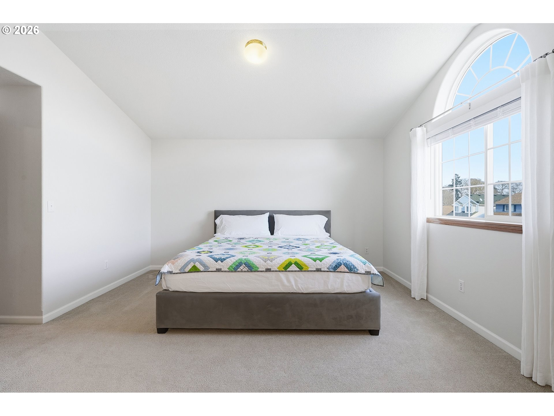 1579 Southwest 213th Avenue Beaverton, OR 97003 - Photo 32 of 48 a bedroom with a bed and window