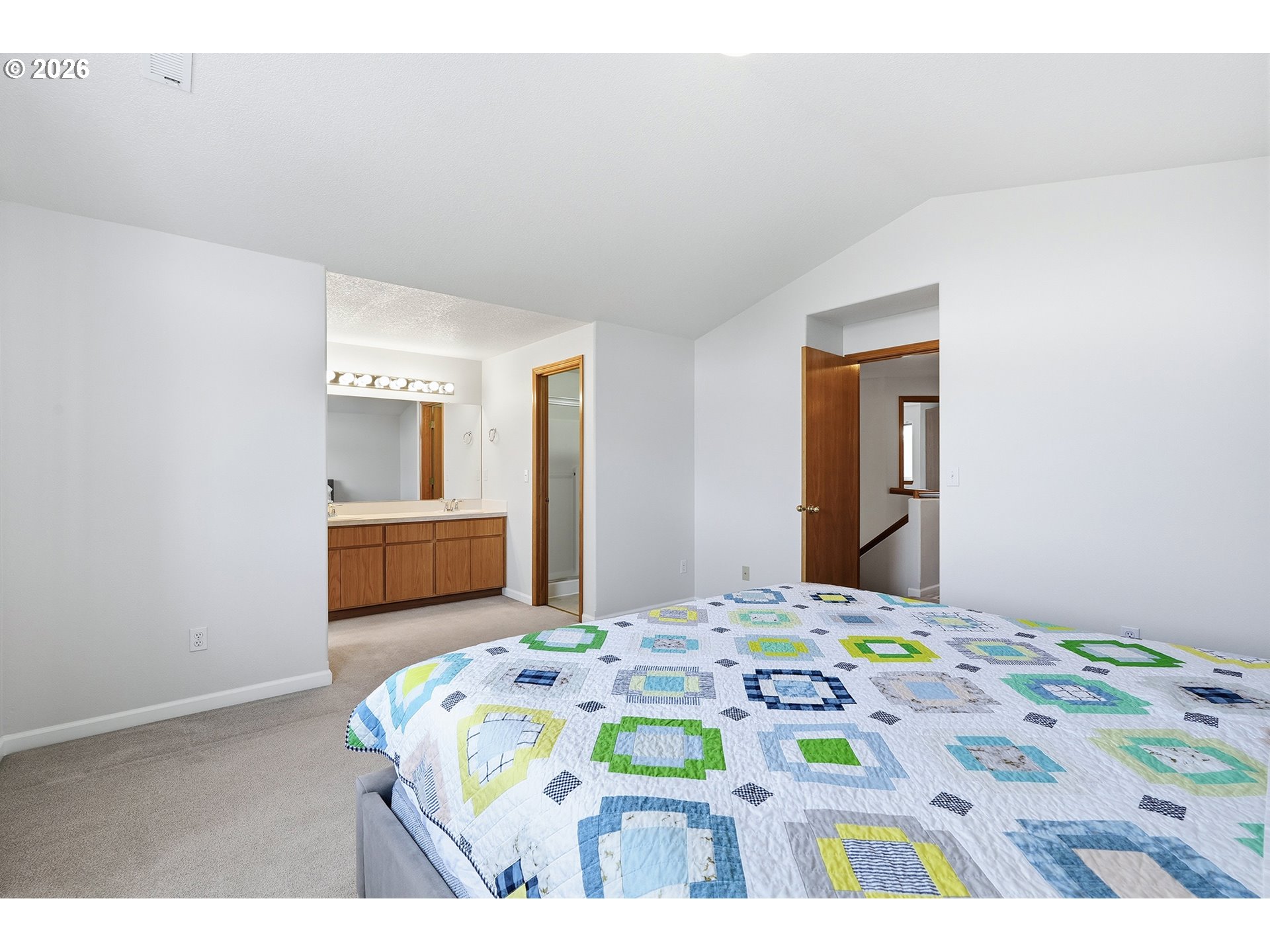 1579 Southwest 213th Avenue Beaverton, OR 97003 - Photo 34 of 48 a bedroom with a bed and a lamp