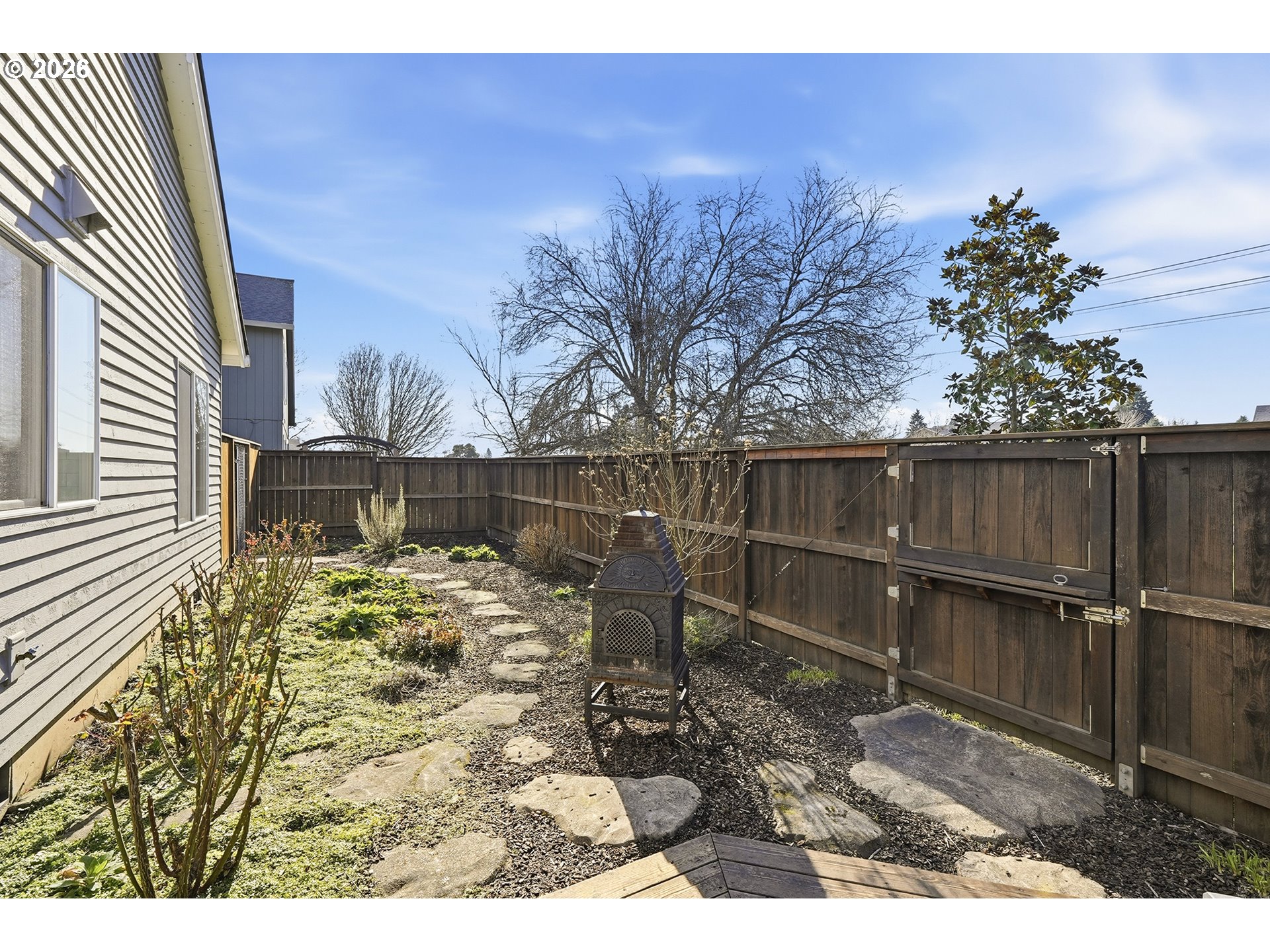 1579 Southwest 213th Avenue Beaverton, OR 97003 - Photo 44 of 48 a view of a backyard with wooden fence