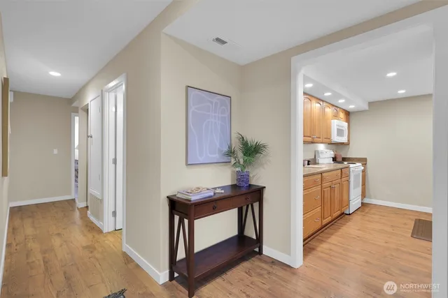 a kitchen with granite countertop a stove and a refrigerator