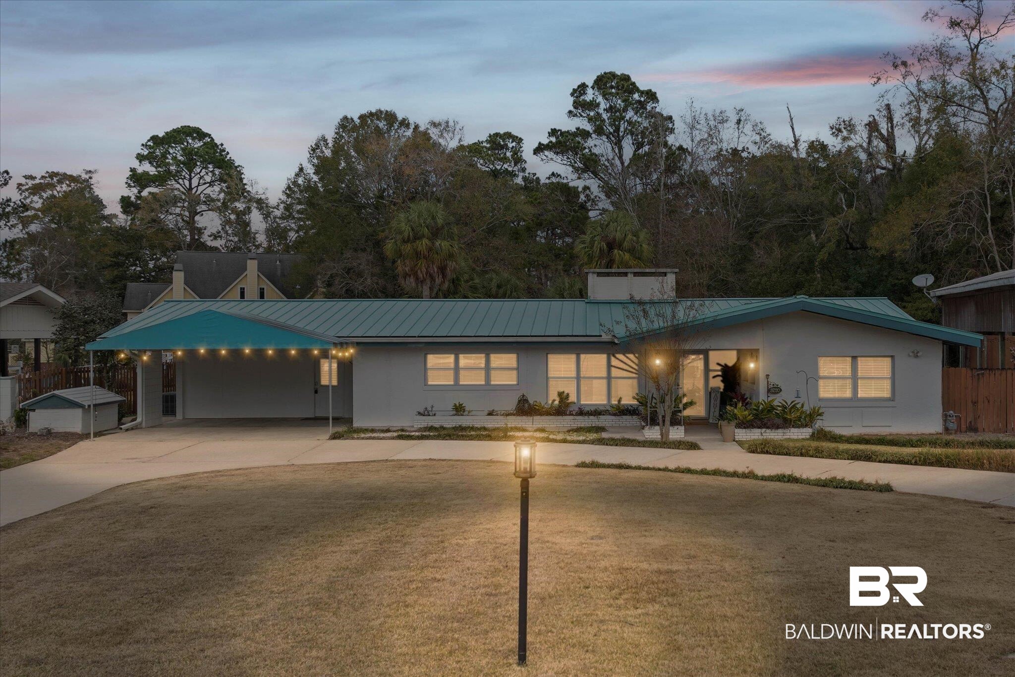 3720 Rabbit Creek Court Theodore, AL 36582 - Photo 1 of 47 View of front facade featuring driveway, a carport, a metal roof, and stucco siding