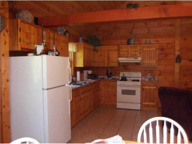 60 Bridge Road Parkman, ME 04443 - Photo 3 of 16 Kitchen. Kitchen with refrigerator,...