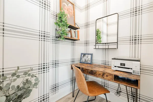 a kitchen with a table chairs and a sink