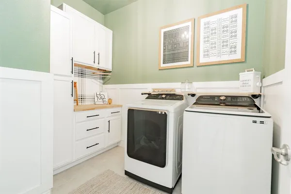 a kitchen with cabinets appliances and a window