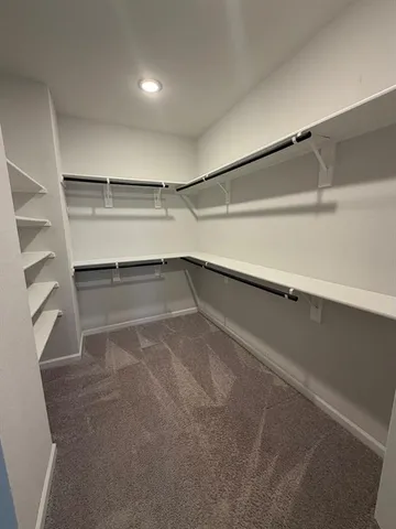 a view of an empty walk in closet