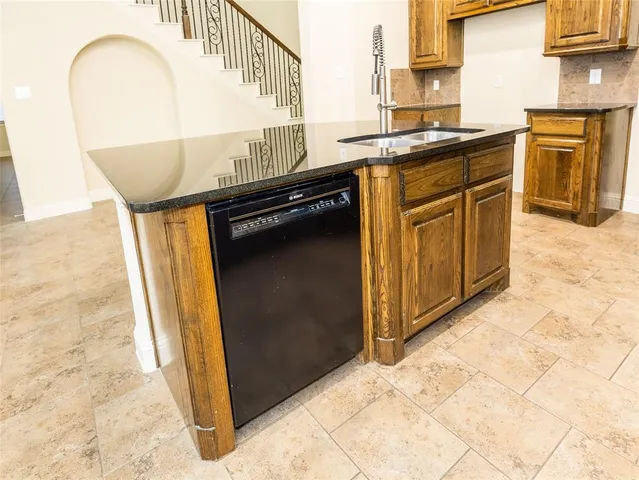 a kitchen with a stove and a cabinets