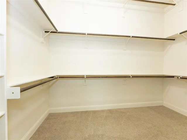a view of a room with an empty walk in closet
