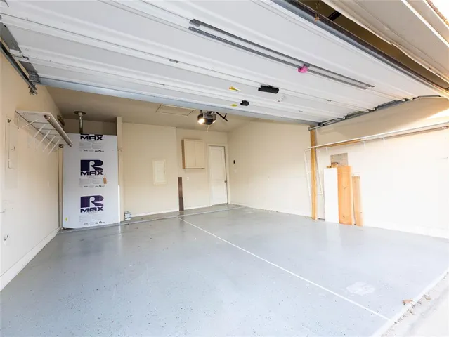 a view of a house with a yard and garage