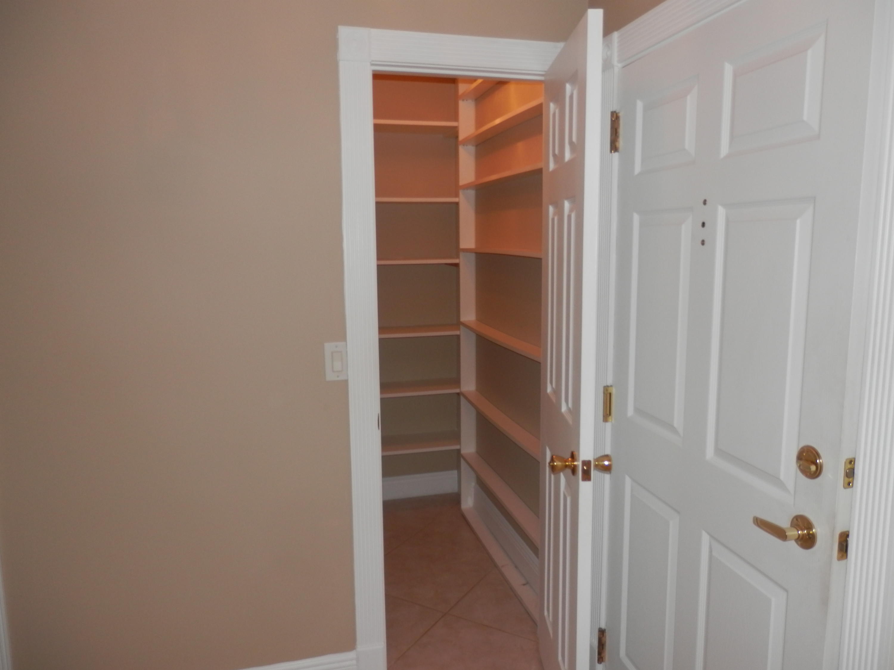 336 Golfview Road, Unit PH5 North Palm Beach, FL 33408 - Photo 11 of 11 a view of walk in closet with empty racks