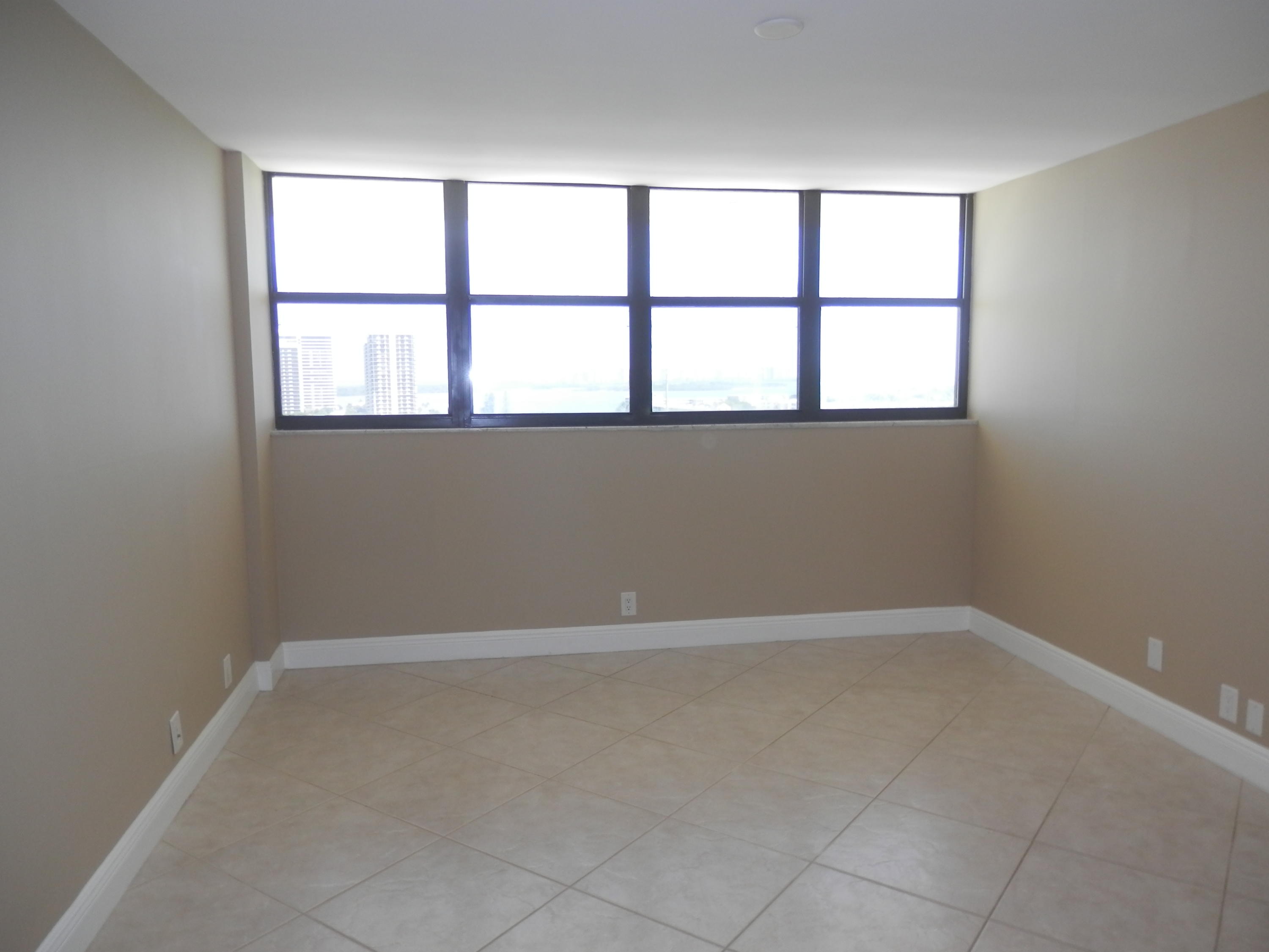 336 Golfview Road, Unit PH5 North Palm Beach, FL 33408 - Photo 6 of 11 an empty room with a window