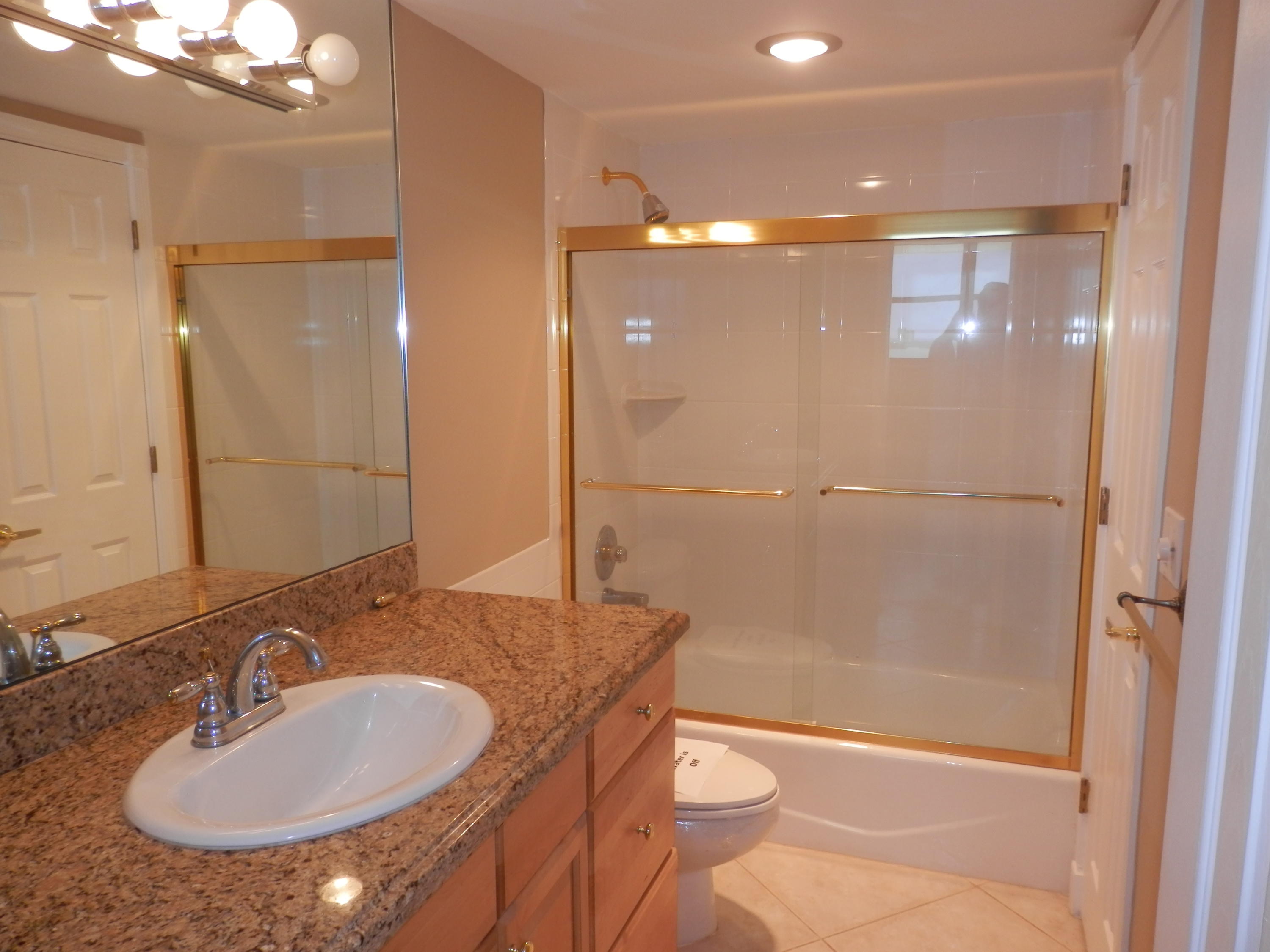336 Golfview Road, Unit PH5 North Palm Beach, FL 33408 - Photo 10 of 11 a bathroom with a sink and a mirror