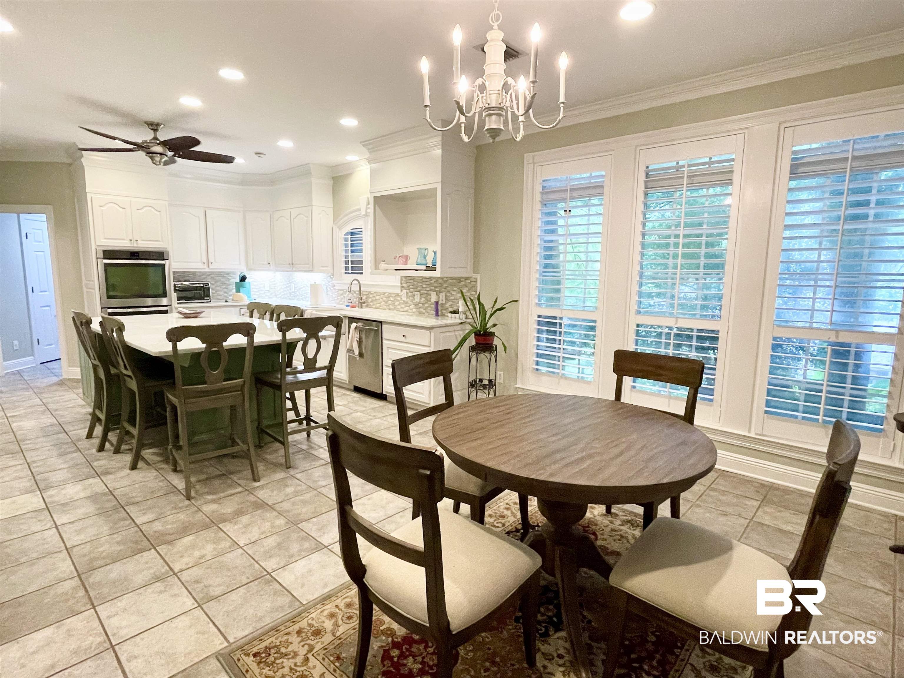 202 Potters Mills Road Daphne, AL 36526 - Photo 8 of 29 Dining area with chandelier and French door leading to back deck