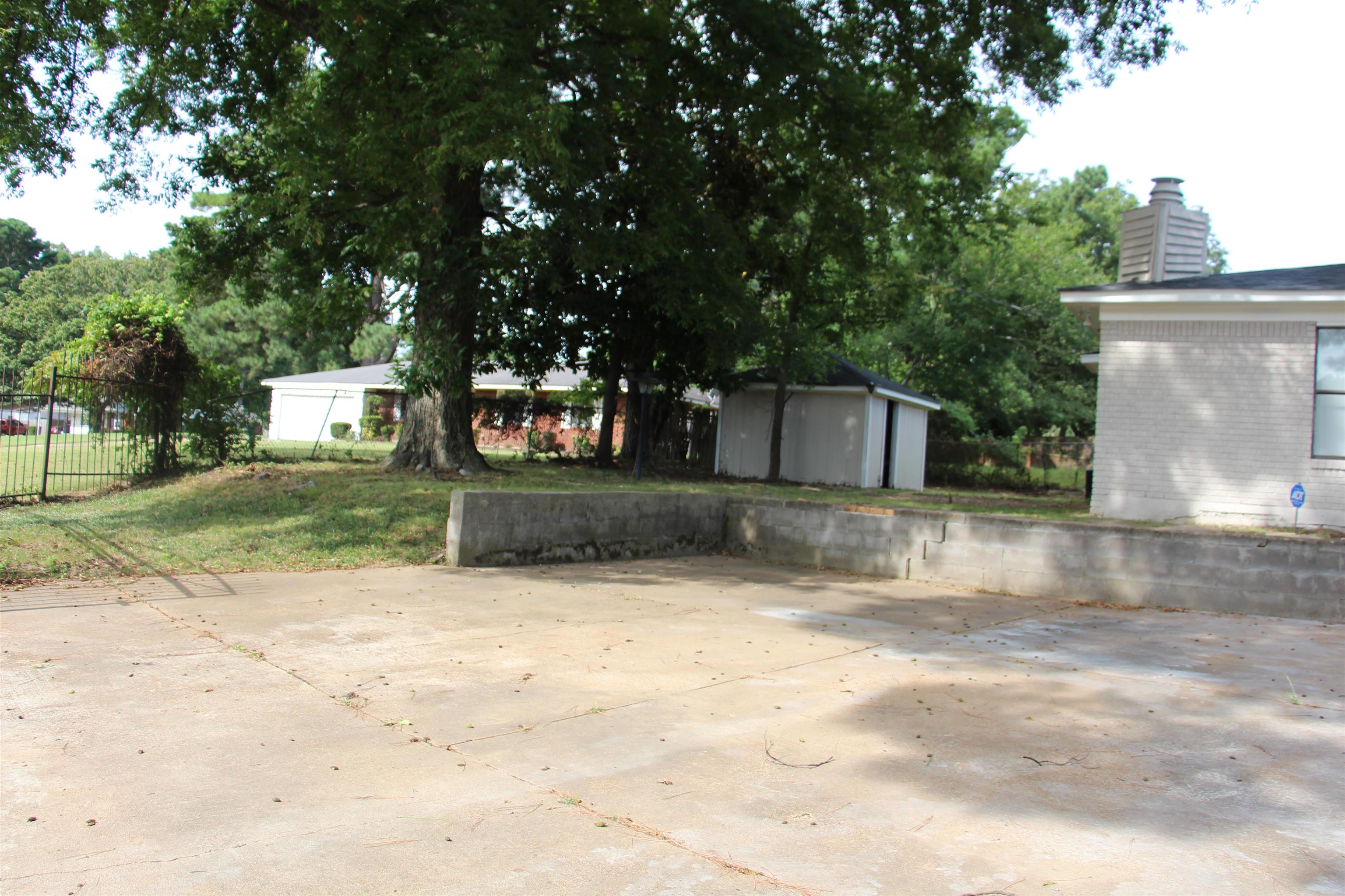545 Dreger Road Memphis, TN 38109 - Photo 23 of 26 a view of a house with a yard
