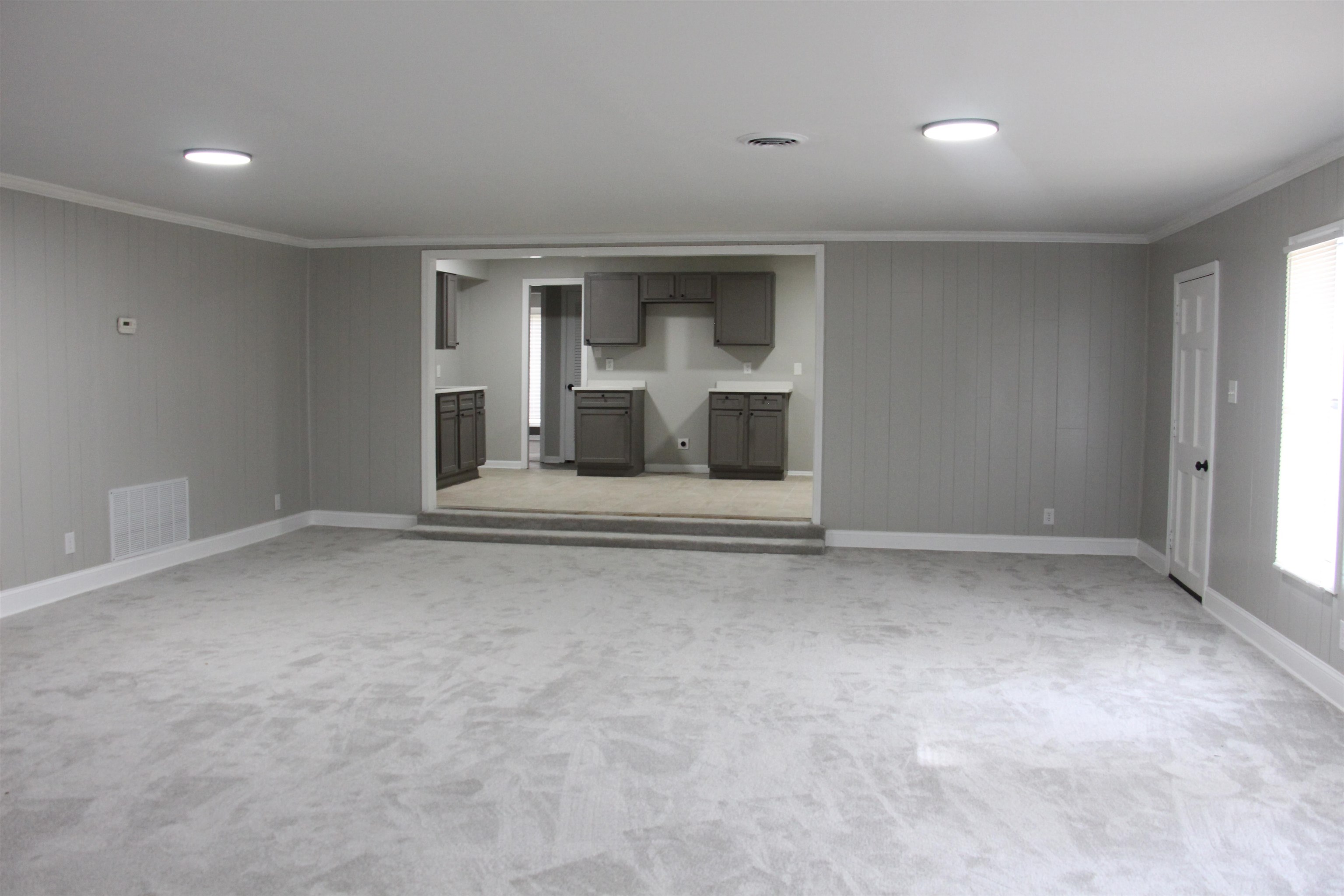 545 Dreger Road Memphis, TN 38109 - Photo 6 of 26 a view of an empty room with a fireplace