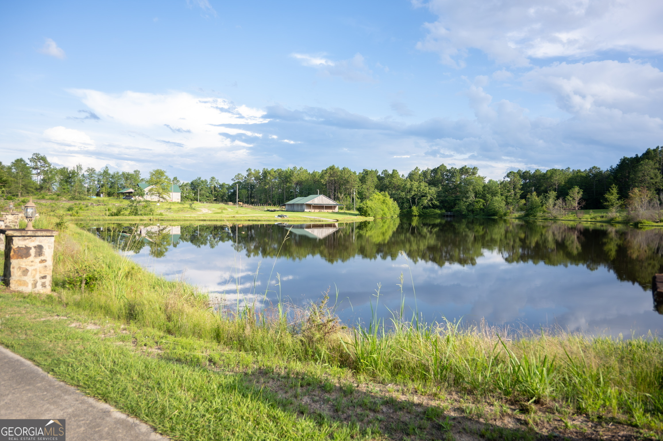 1940 Horne Road Eastman, GA 31023 - Photo 13 of 94 a view of a lake with houses in the back