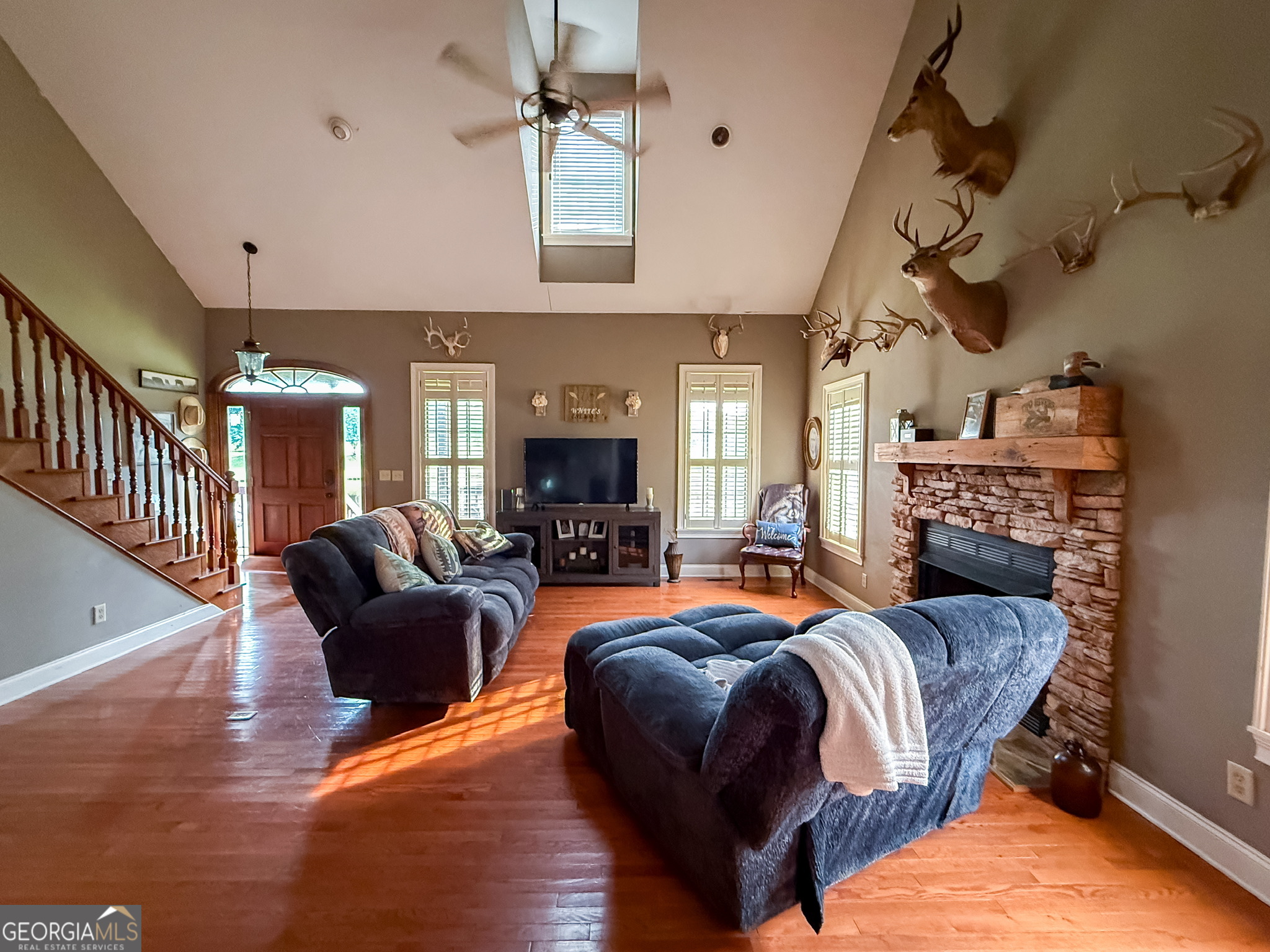 1940 Horne Road Eastman, GA 31023 - Photo 24 of 94 a living room with fireplace furniture and a wooden floor