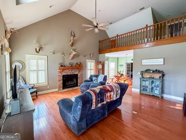 a bedroom with bed and a chandelier