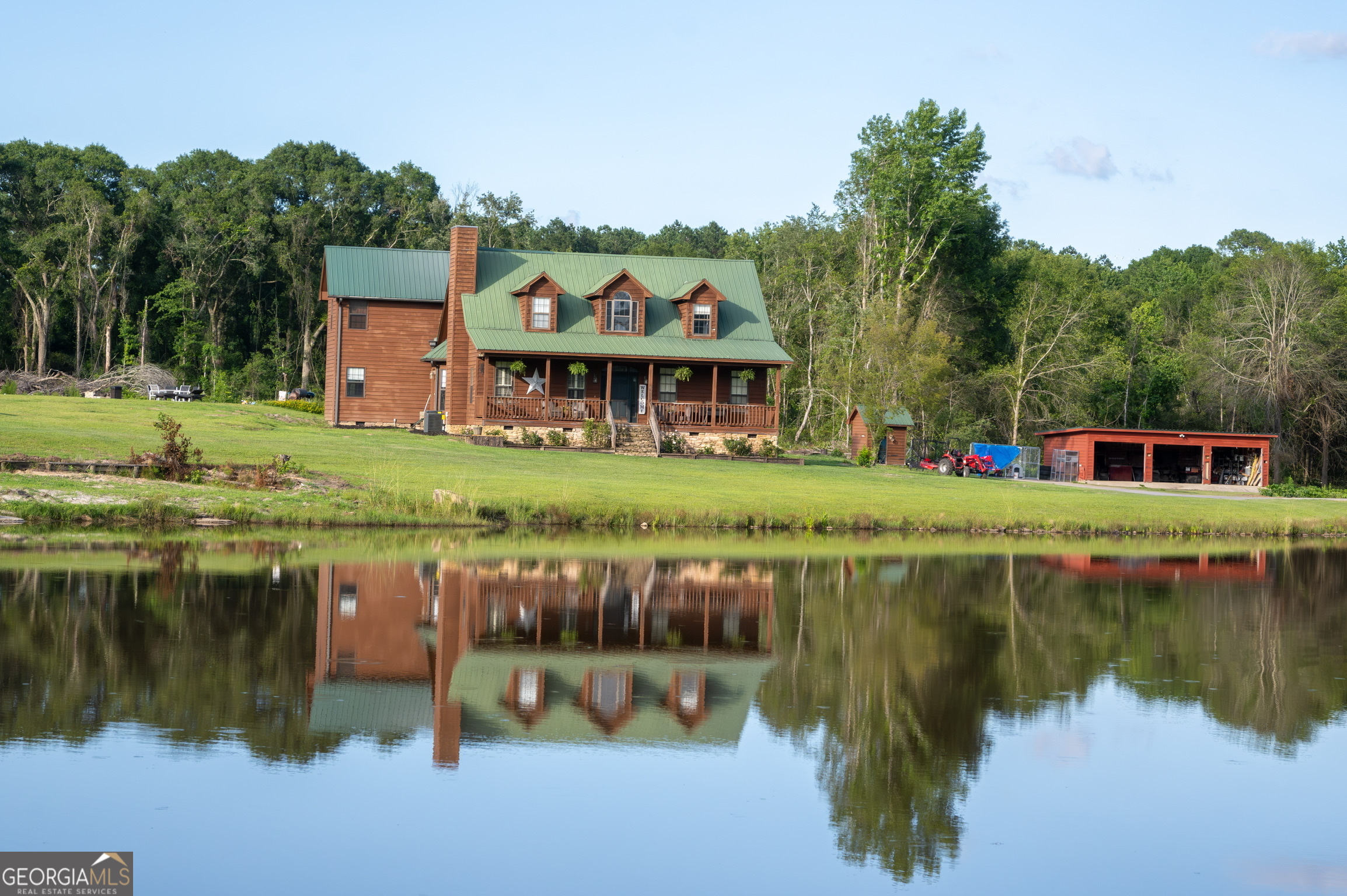 1940 Horne Road Eastman, GA 31023 - Photo 3 of 94 a view of a house next to a lake with a large trees