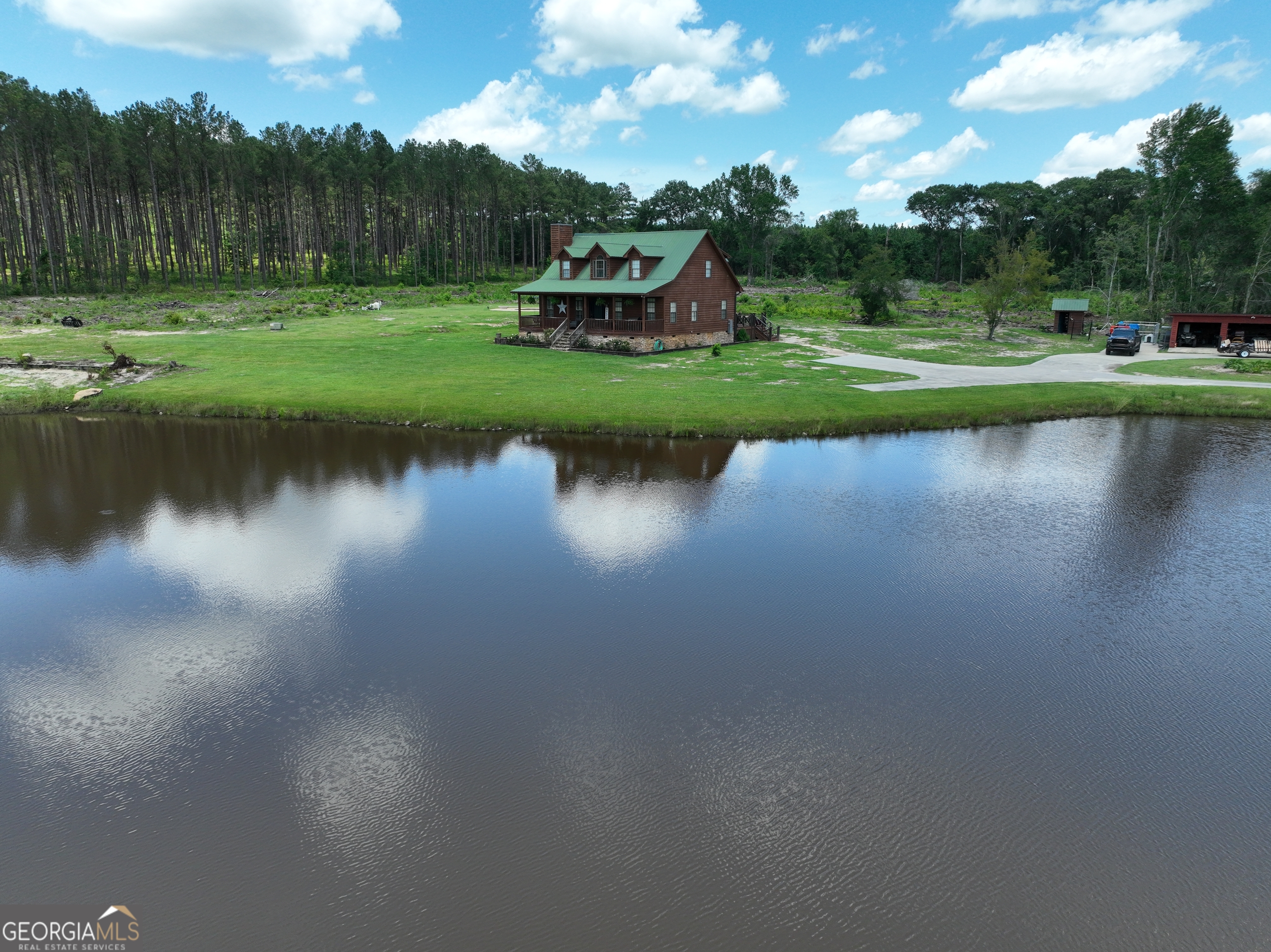 1940 Horne Road Eastman, GA 31023 - Photo 84 of 94 a view of a lake in front of house with outdoor and green space