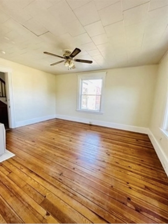 12 Princeton Avenue, Unit 2 Easthampton, MA 01027 - Photo 11 of 20 an empty room with wooden floor and windows
