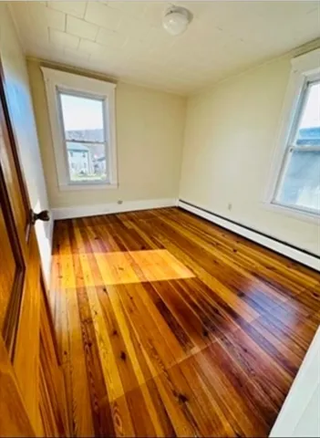a bathroom with a sink mirror vanity and toilet