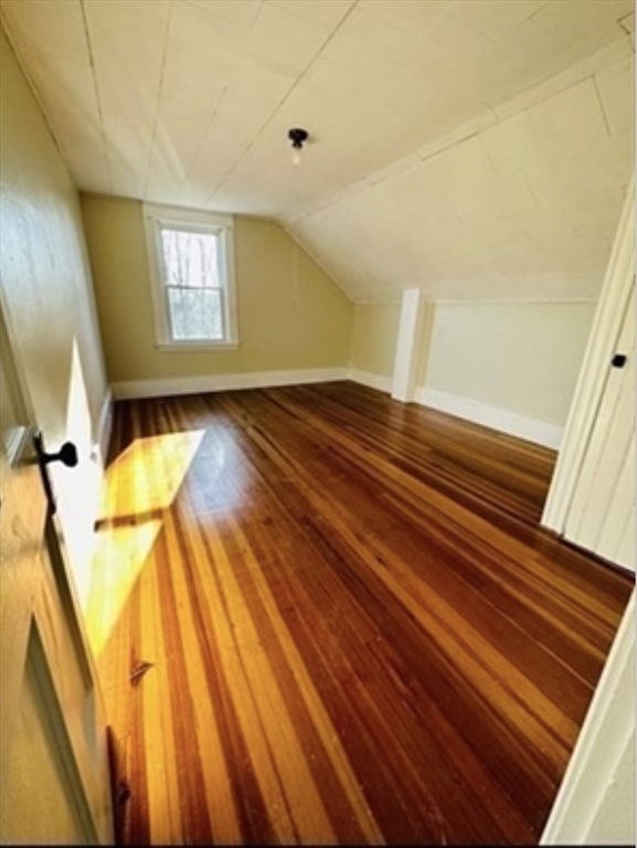 12 Princeton Avenue, Unit 2 Easthampton, MA 01027 - Photo 17 of 20 a view of a room with wooden floor and staircase