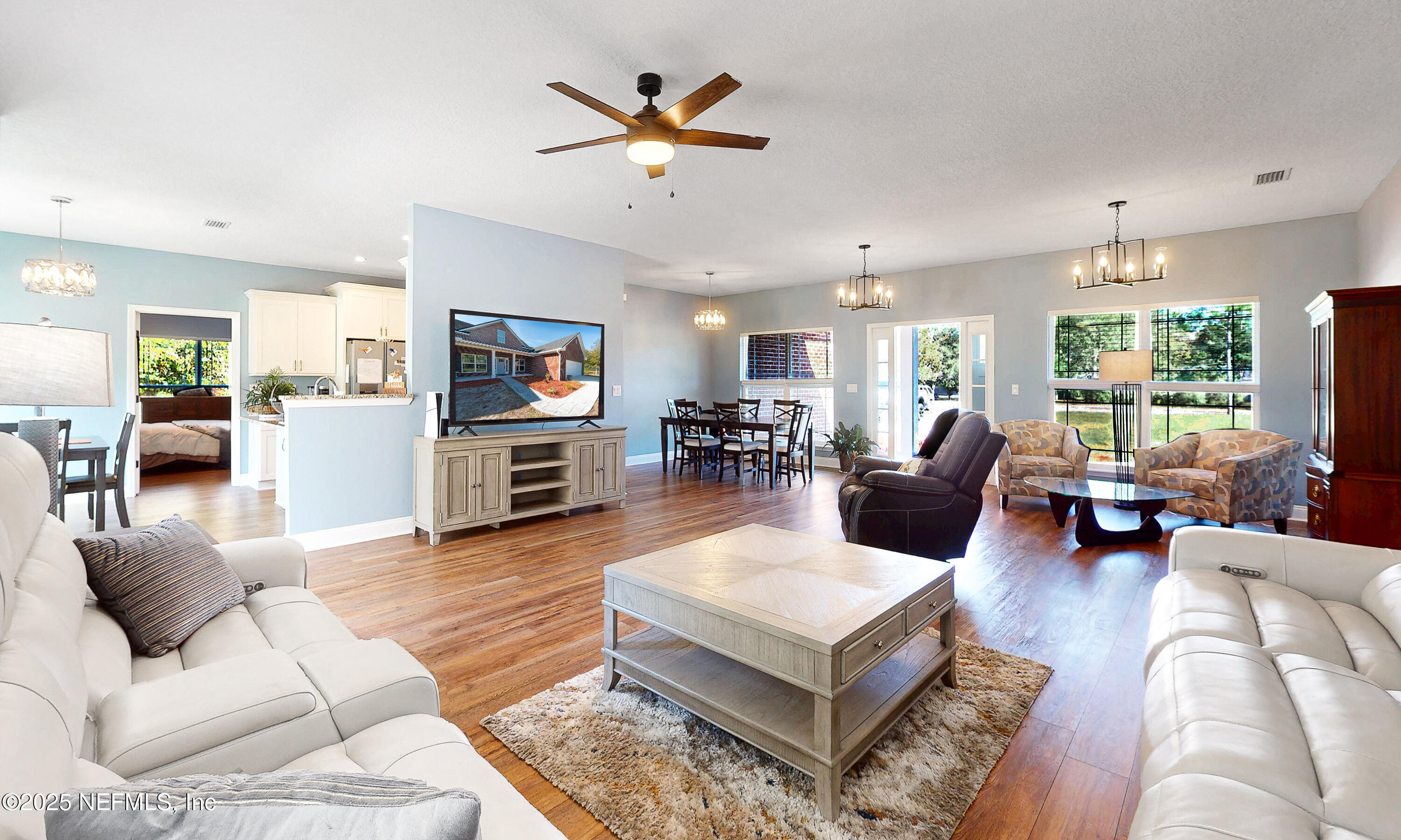 2414 Range Line Road Middleburg, FL 32068 - Photo 10 of 39 a living room with furniture kitchen view and a wooden floor